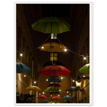 Nighttime street scene with colorful illuminated umbrellas hanging as decoration above a vibrant outdoor area on a wooden frame wall art