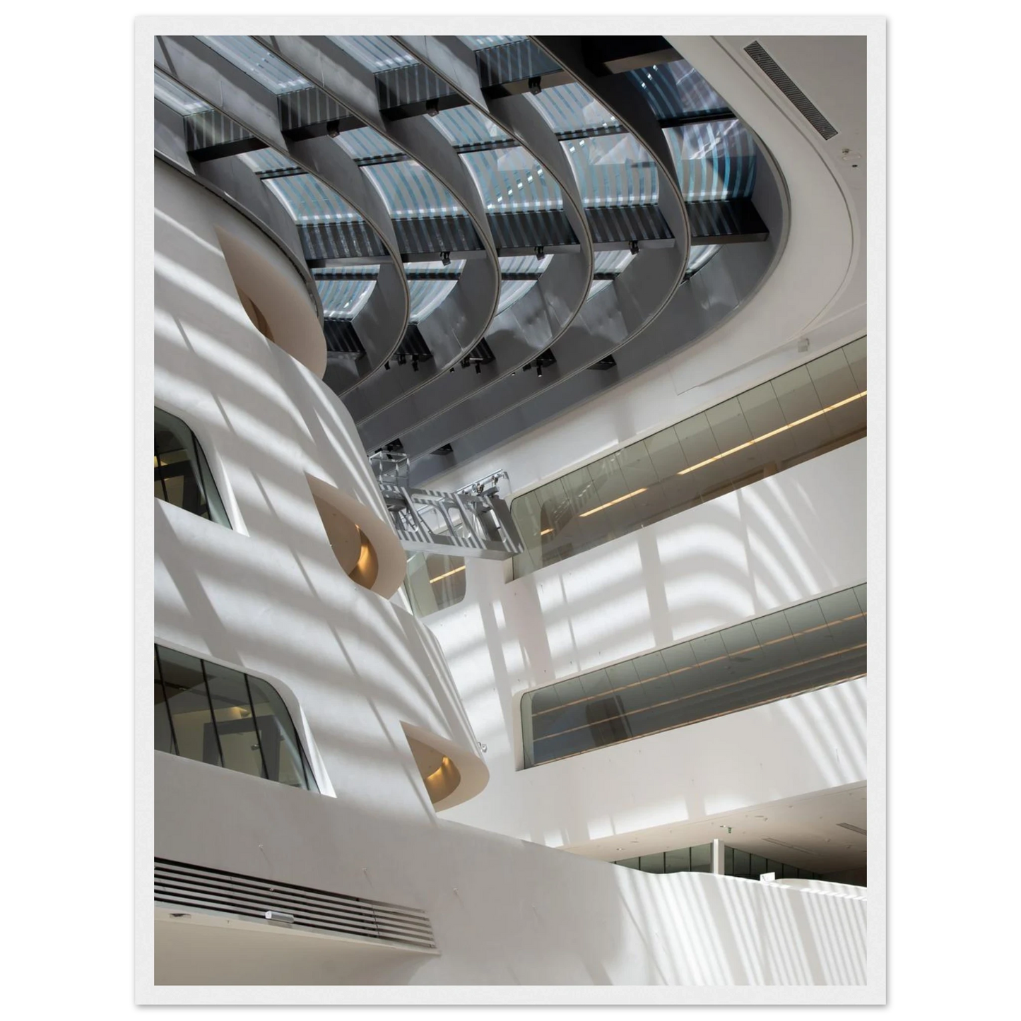 Interior view of the Library of WU (Vienna University of Economics and Business) on wooden frame wall art featuring modern architecture with multiple floors and open study spaces