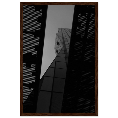 Black and white Low angle view looking up at a tall glass skyscraper framed between two metal structural elements on Wooden frame wall art