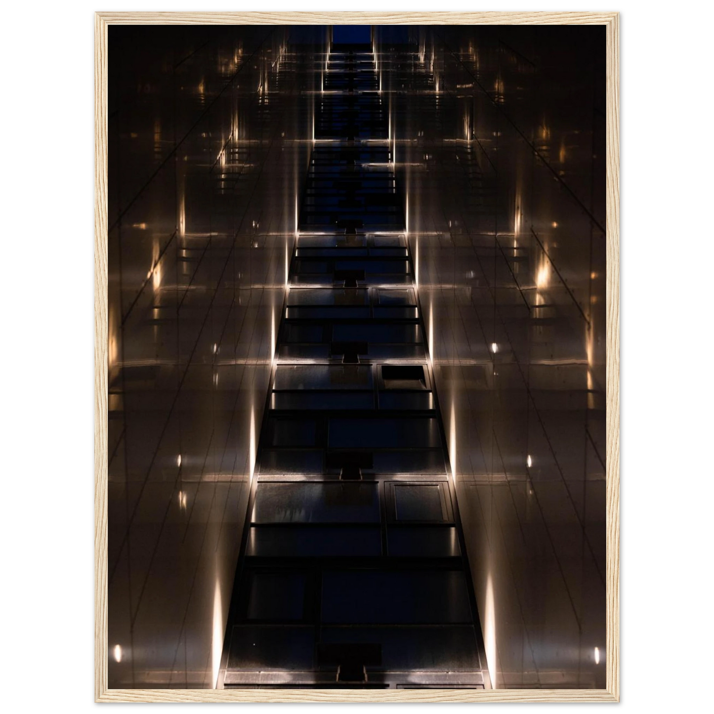 Low angle view looking up a narrow corridor-like passage between two skyscraper walls lined with rows of windows stretching toward the sky on wooden framed wall art