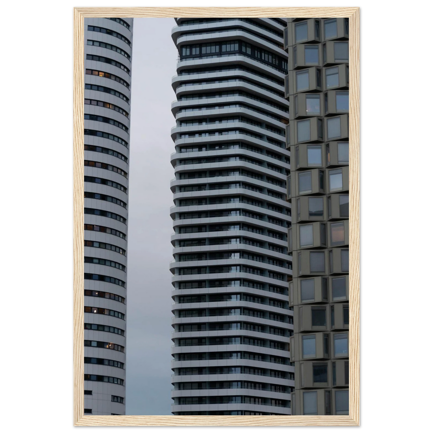 Modern high rise tower buildings with glass and steel facade reaching into the sky on wodden framed wall art