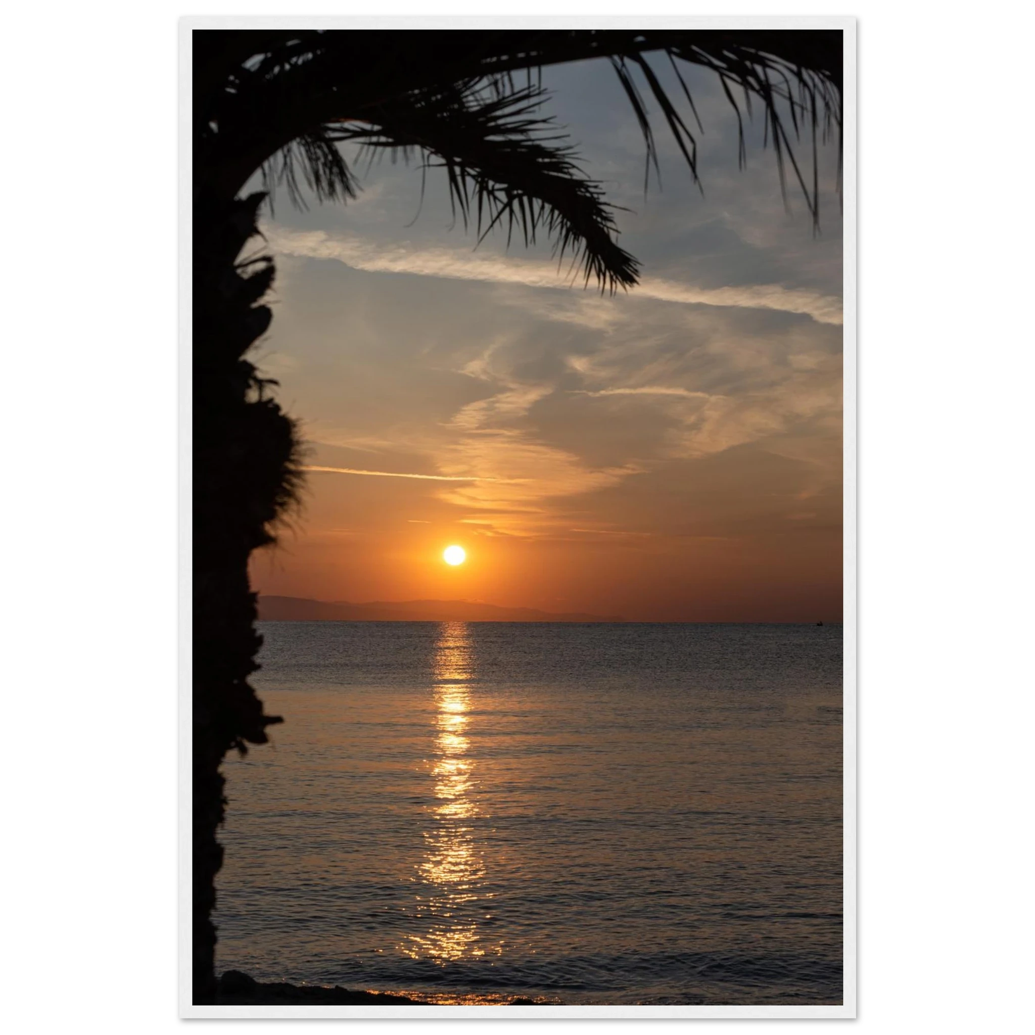 Wooden framed wall art Sunset over calm water with golden reflections, framed by tree branches in a peaceful natural landscape