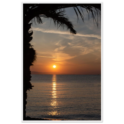 Wooden framed wall art Sunset over calm water with golden reflections, framed by tree branches in a peaceful natural landscape