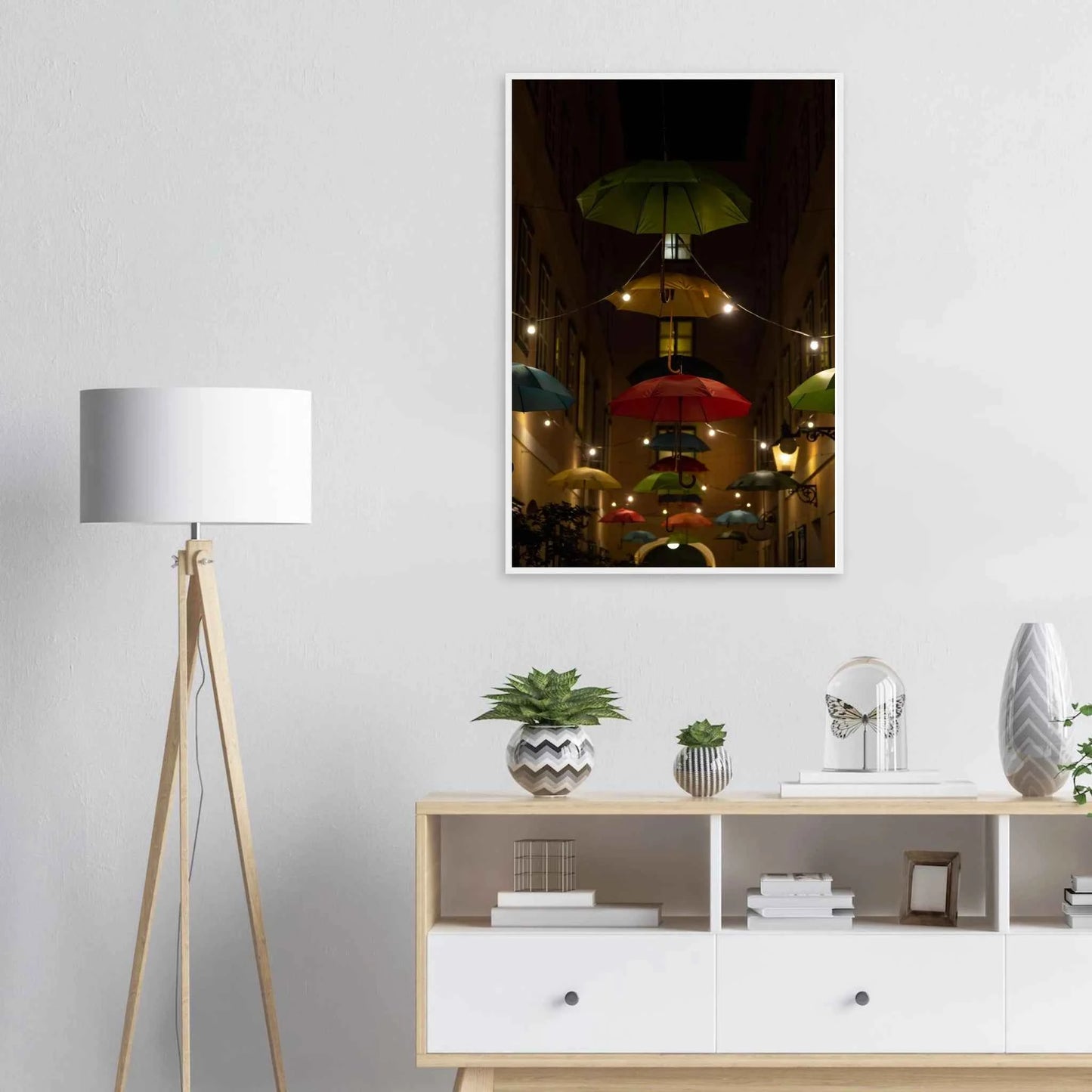 Nighttime street scene with colorful illuminated umbrellas hanging as decoration above a vibrant outdoor area on a wooden frame wall art on the wall in the Livingroom
