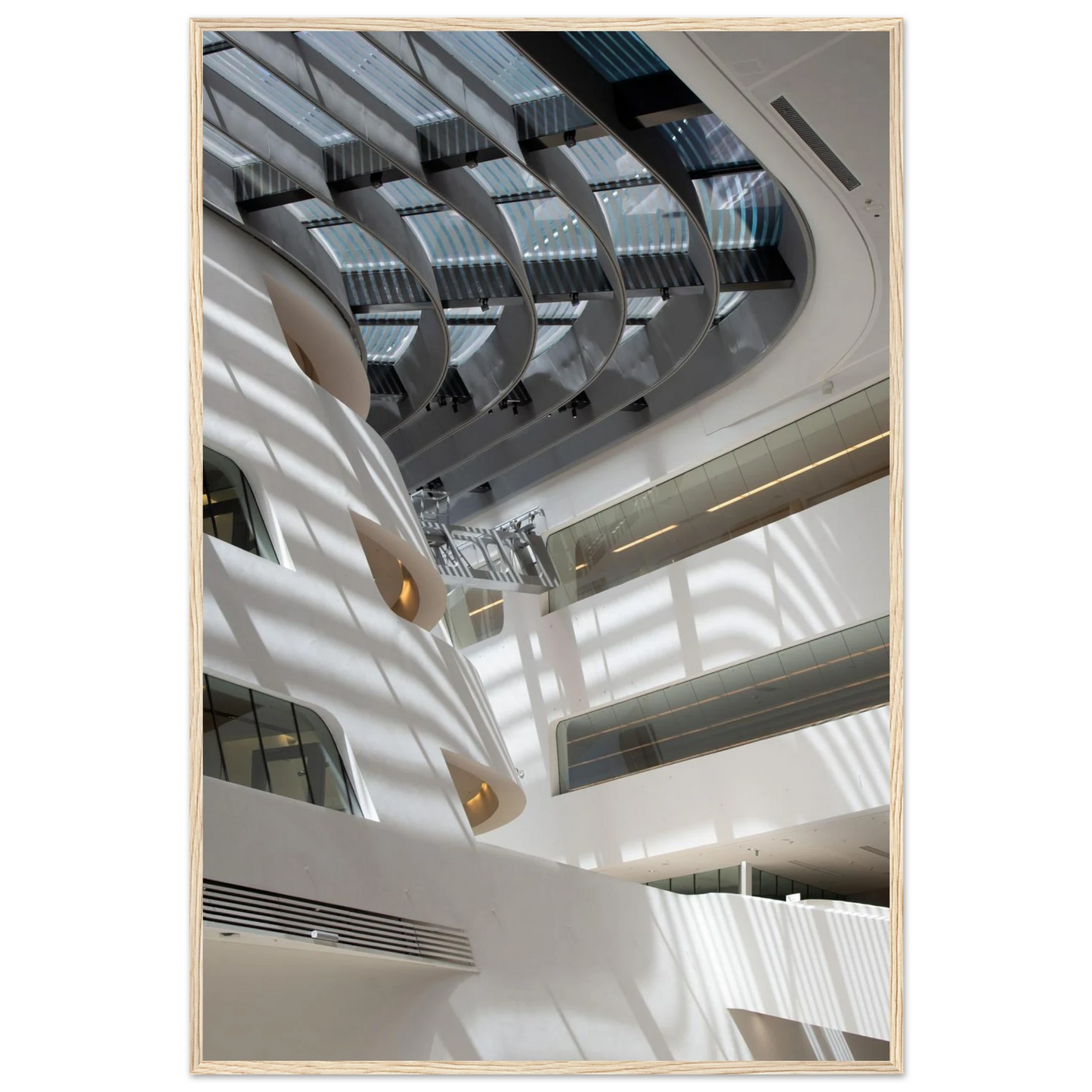 Interior view of the Library of WU (Vienna University of Economics and Business) on wooden frame wall art featuring modern architecture with multiple floors and open study spaces