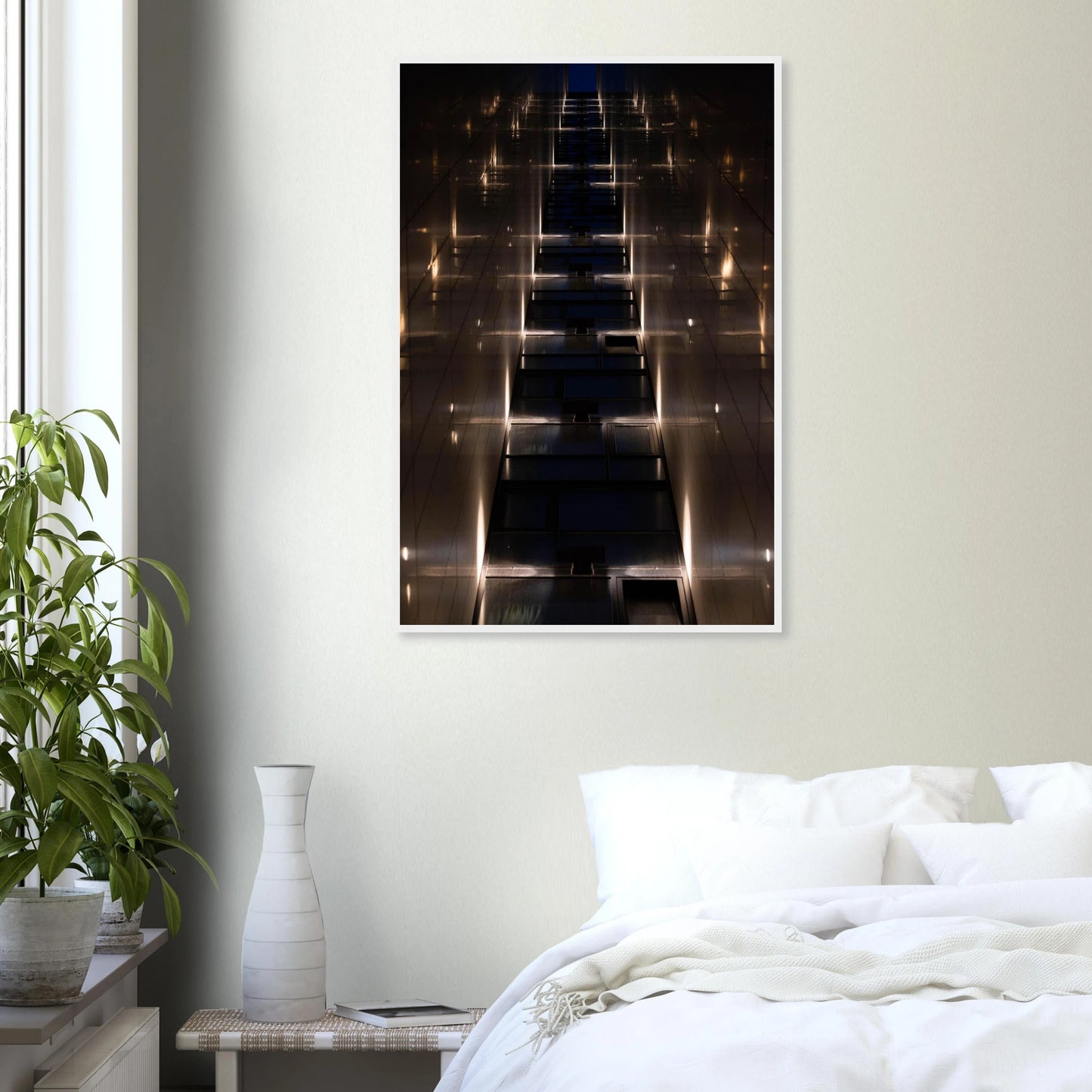 Low angle view looking up a narrow corridor-like passage between two skyscraper walls lined with rows of windows stretching toward the sky on wooden framed wall art on the wall in the Bedroom