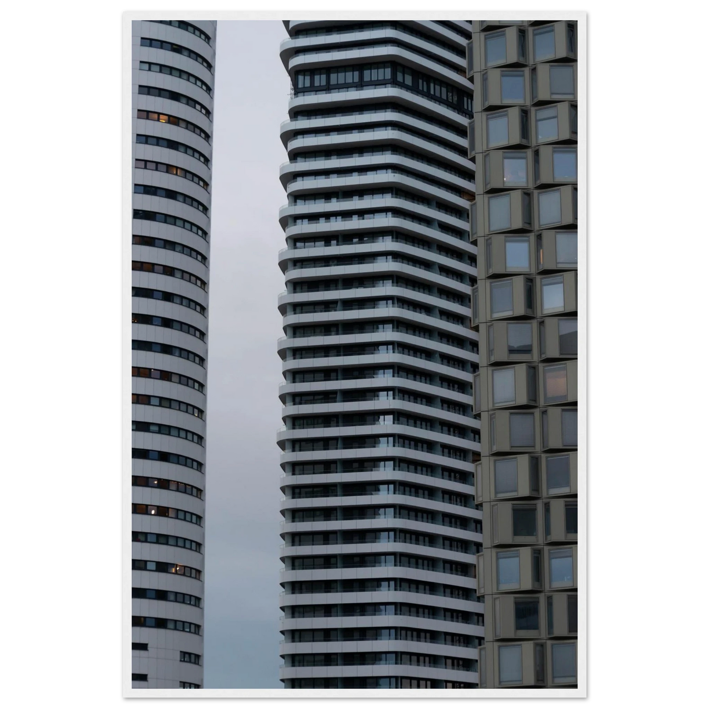 Modern high rise tower buildings with glass and steel facade reaching into the sky on wodden framed wall art