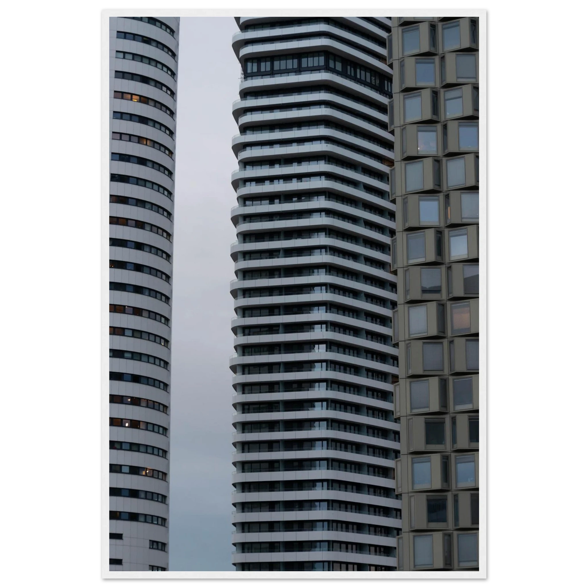 Modern high rise tower buildings with glass and steel facade reaching into the sky on wodden framed wall art