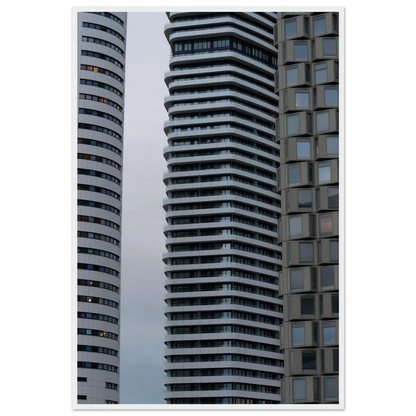 Modern high rise tower buildings with glass and steel facade reaching into the sky on wodden framed wall art