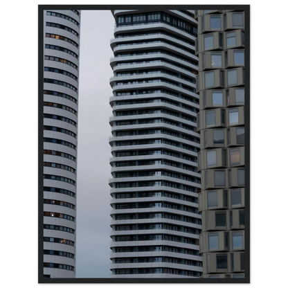 Modern high rise tower buildings with glass and steel facade reaching into the sky on wodden framed wall art