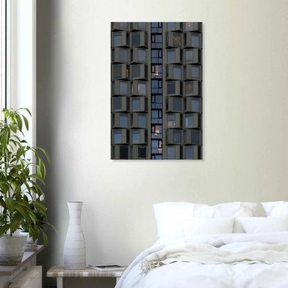 Close up view of a modern building facade with a grid of reflective glass windows on Canvas print wall art on the wall in the Bedroom