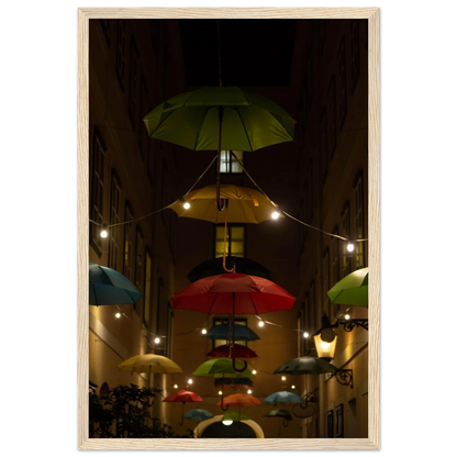 Nighttime street scene with colorful illuminated umbrellas hanging as decoration above a vibrant outdoor area on a wooden frame wall art