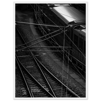 Black and white aerial view of metro train and railway tracks in an urban underground or elevated rail system on wooden framed wall art