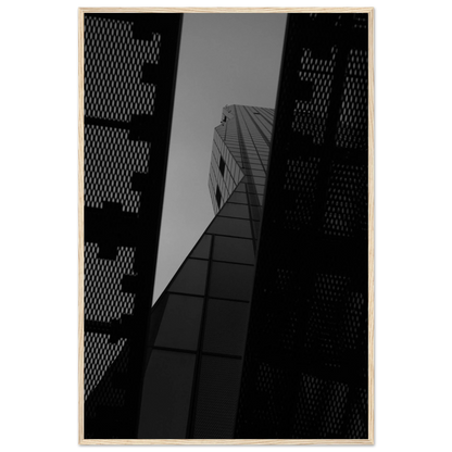 Black and white Low angle view looking up at a tall glass skyscraper framed between two metal structural elements on Wooden frame wall art