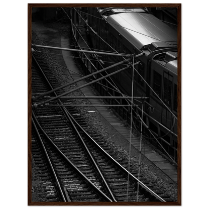 Black and white aerial view of metro train and railway tracks in an urban underground or elevated rail system on wooden framed wall art