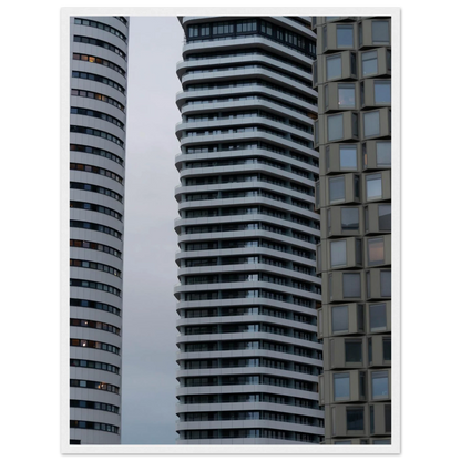 Modern high rise tower buildings with glass and steel facade reaching into the sky on wodden framed wall art