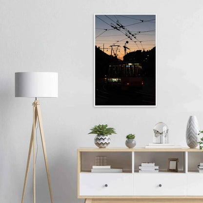 Wooden framed wall art featuring a tram the Nightline driving between houses under power lines during a golden sunset on the wall in the Livingroom