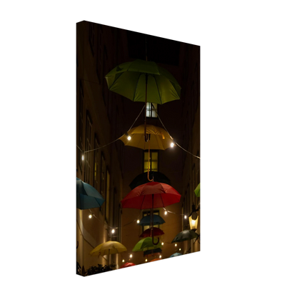 Nighttime street scene with colorful illuminated umbrellas hanging as decoration above a vibrant outdoor area on a Canvas print