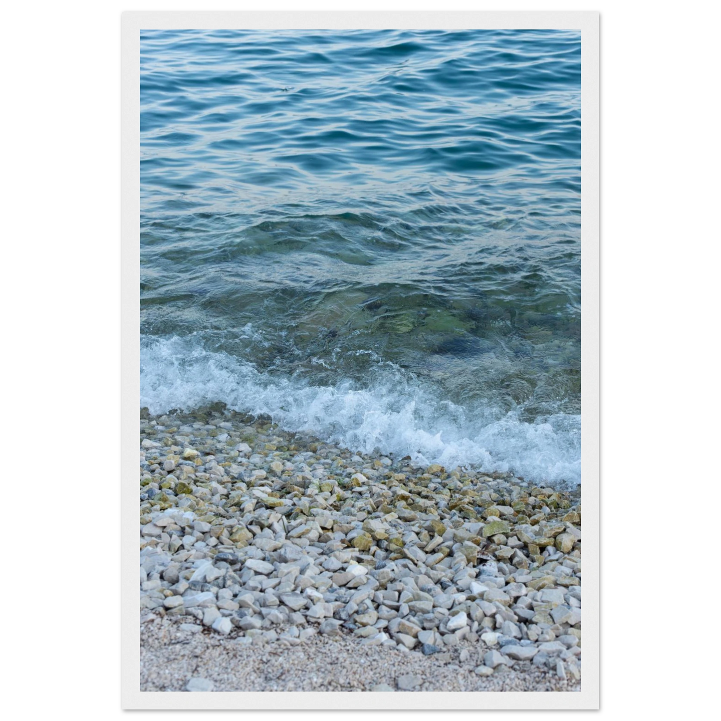 Aerial view ocean beach with wood frame, top down drone shot of blue sea foam and pebbles