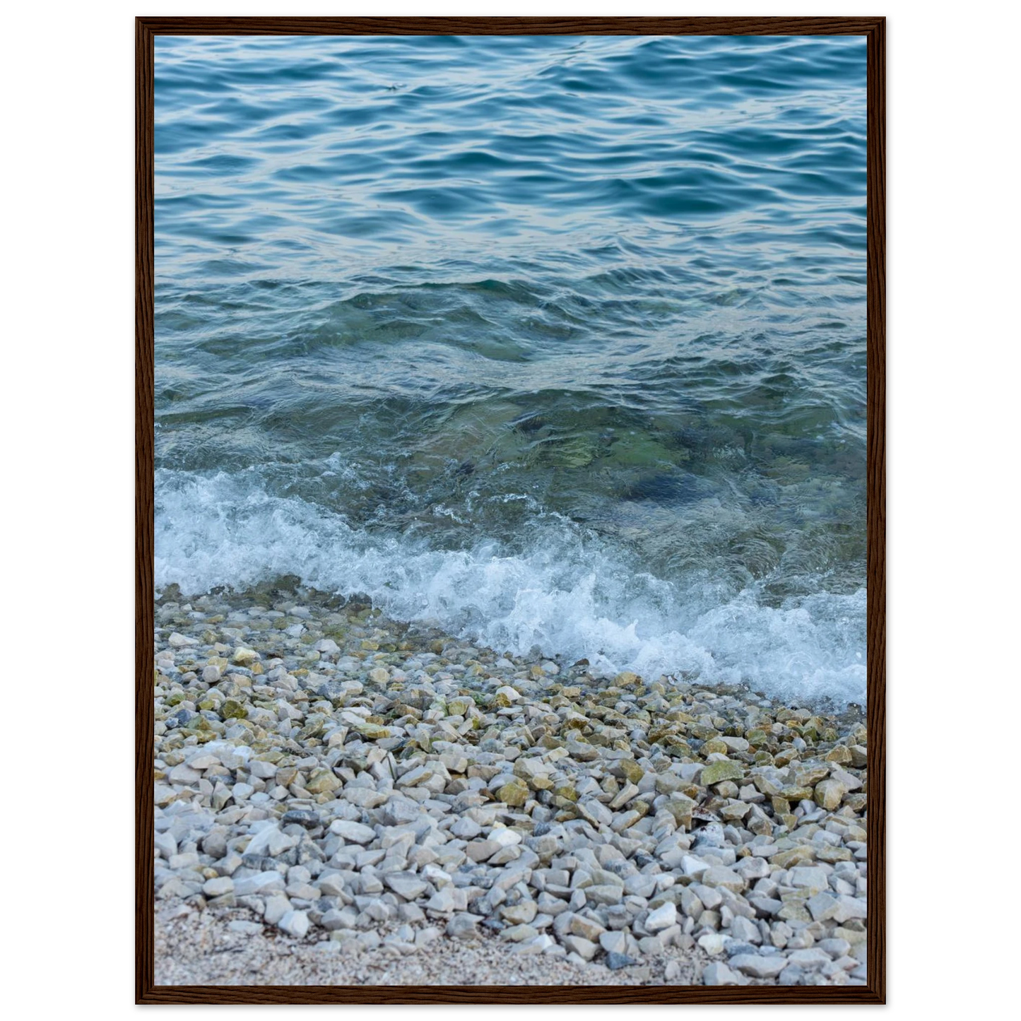 Aerial view ocean beach with wood frame, top down drone shot of blue sea foam and pebbles