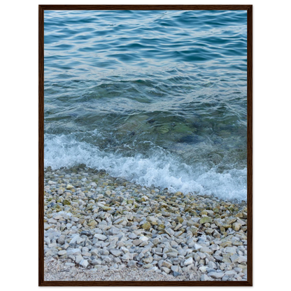 Aerial view ocean beach with wood frame, top down drone shot of blue sea foam and pebbles