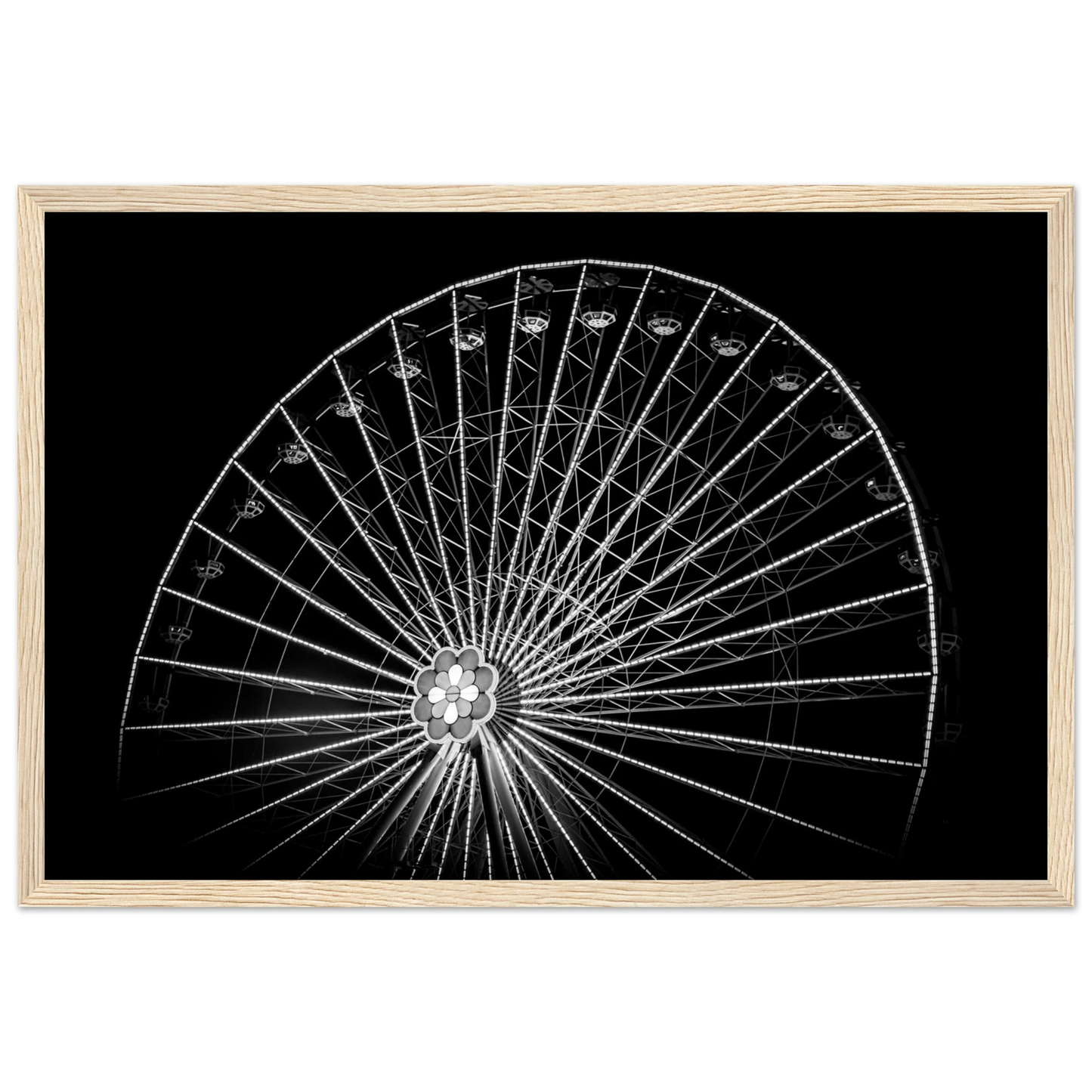 Black and white night photo of the Vienna Prater Giant Ferris Wheel (Wiener Riesenrad) with illuminated spokes forming a circular pattern against the dark sky on wooden framed wall art