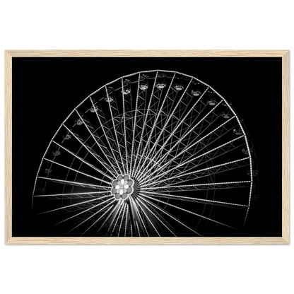 Black and white night photo of the Vienna Prater Giant Ferris Wheel (Wiener Riesenrad) with illuminated spokes forming a circular pattern against the dark sky on wooden framed wall art