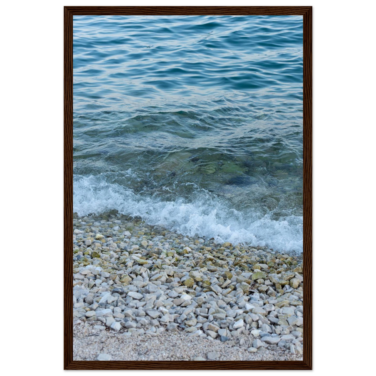 Aerial view ocean beach with wood frame, top down drone shot of blue sea foam and pebbles