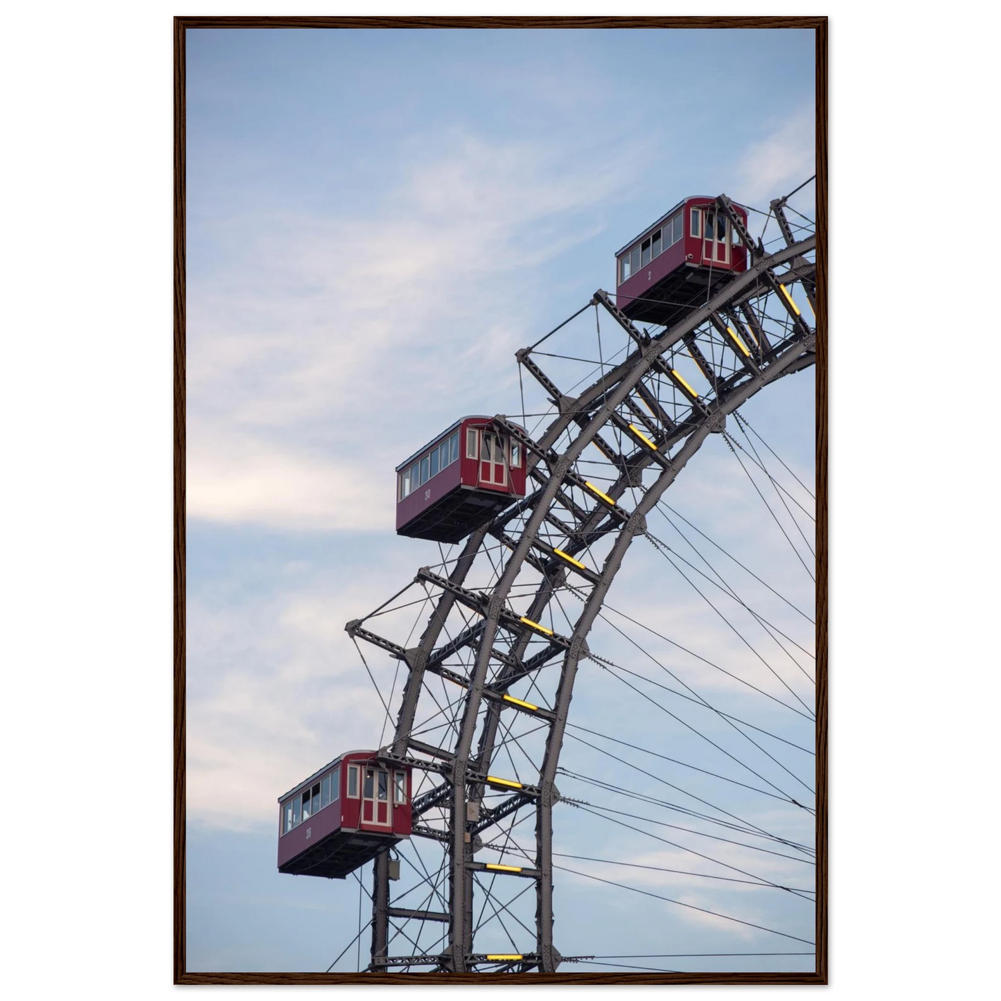 Close up of the historic Vienna Prater Giant Ferris Wheel (Wiener Riesenrad) showing its iconic steel structure and vintage mechanical details on wooden framed wall art