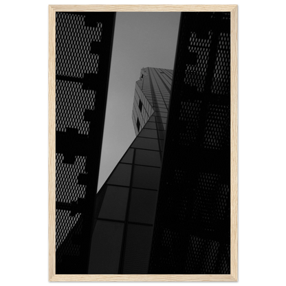 Black and white Low angle view looking up at a tall glass skyscraper framed between two metal structural elements on Wooden frame wall art