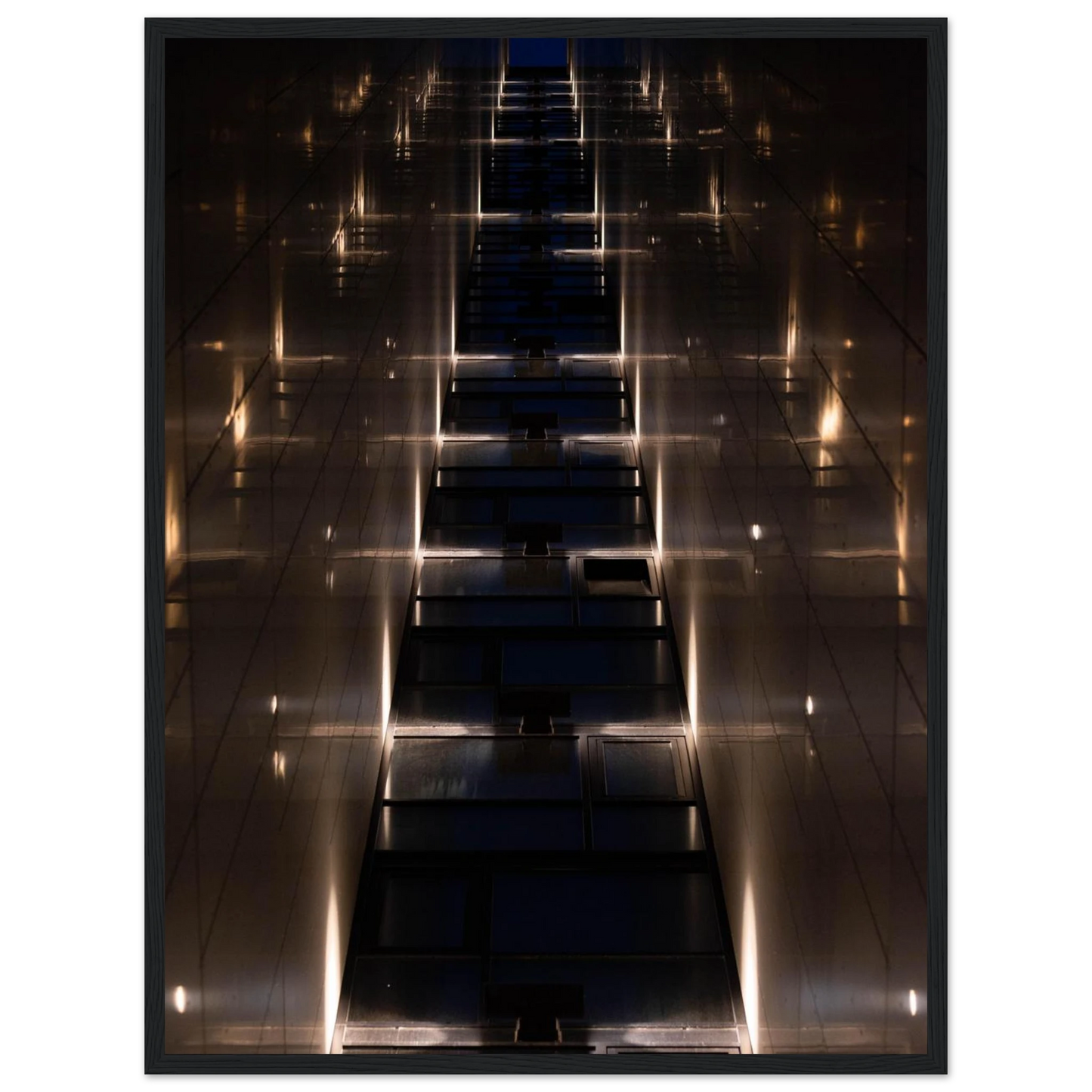 Low angle view looking up a narrow corridor-like passage between two skyscraper walls lined with rows of windows stretching toward the sky on wooden framed wall art