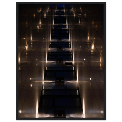 Low angle view looking up a narrow corridor-like passage between two skyscraper walls lined with rows of windows stretching toward the sky on wooden framed wall art