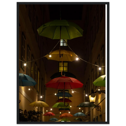 Nighttime street scene with colorful illuminated umbrellas hanging as decoration above a vibrant outdoor area on a wooden frame wall art