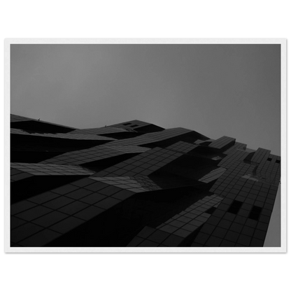Black and white low angle view of a modern skyscraper with bold geometric lines and dark textured facade on wooden framed wall art