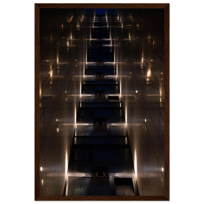 Low angle view looking up a narrow corridor-like passage between two skyscraper walls lined with rows of windows stretching toward the sky on wooden framed wall art