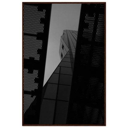 Black and white Low angle view looking up at a tall glass skyscraper framed between two metal structural elements on Wooden frame wall art
