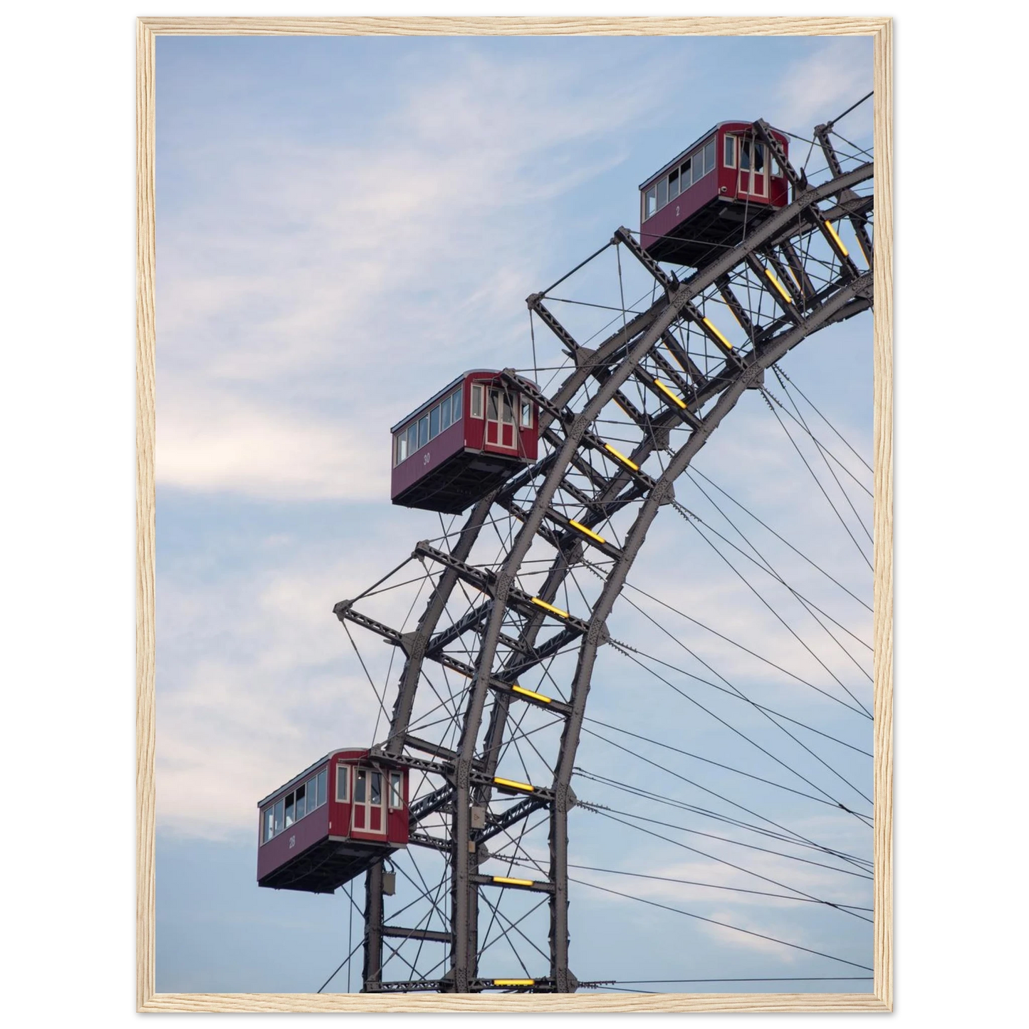 Close up of the historic Vienna Prater Giant Ferris Wheel (Wiener Riesenrad) showing its iconic steel structure and vintage mechanical details on wooden framed wall art