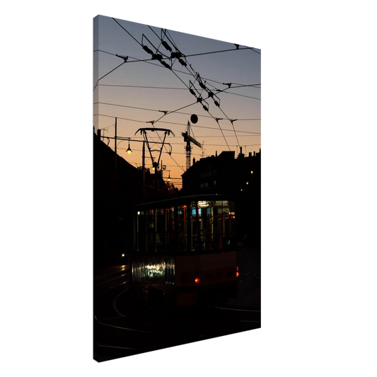 Canvas Print wall art featuring a tram the Nightline driving between houses under power lines during a golden sunset