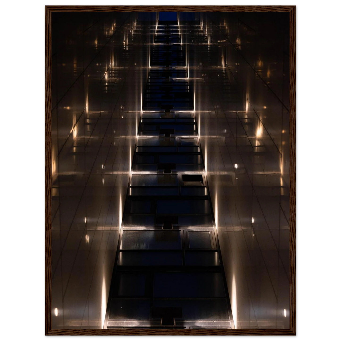 Low angle view looking up a narrow corridor-like passage between two skyscraper walls lined with rows of windows stretching toward the sky on wooden framed wall art