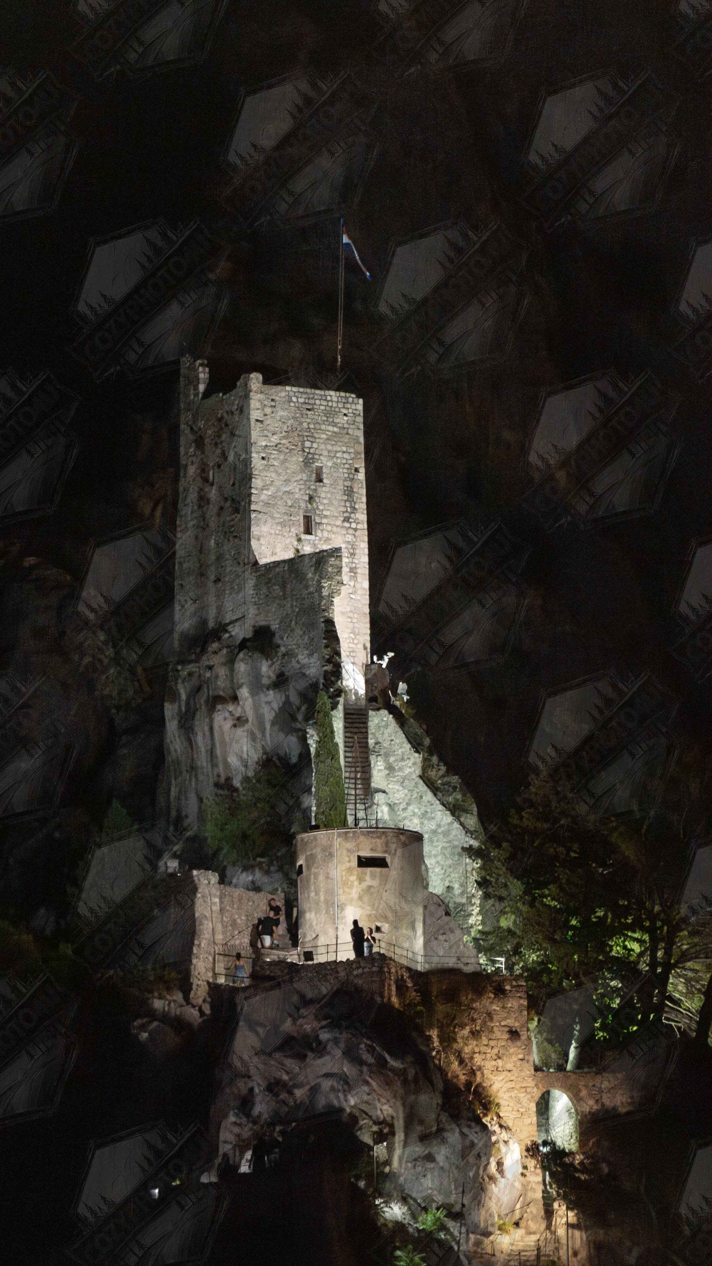 Digital picture wall art of an ancient stone bastion decorated with green climbing plants against a dark background in Shadow Keep