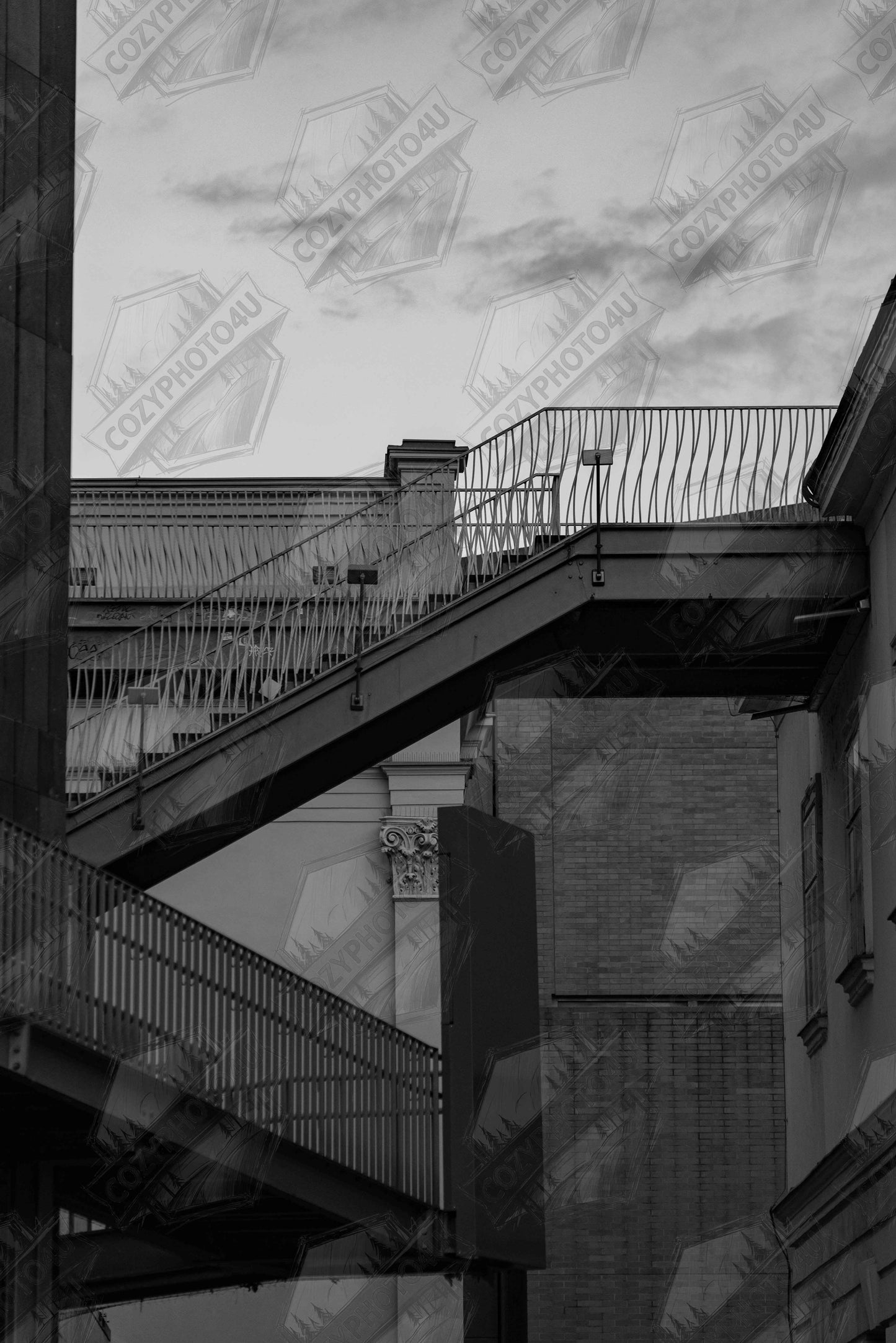 Digital Picture art Black and white photo of an outdoor staircase connecting two buildings under a dramatic cloudy sky