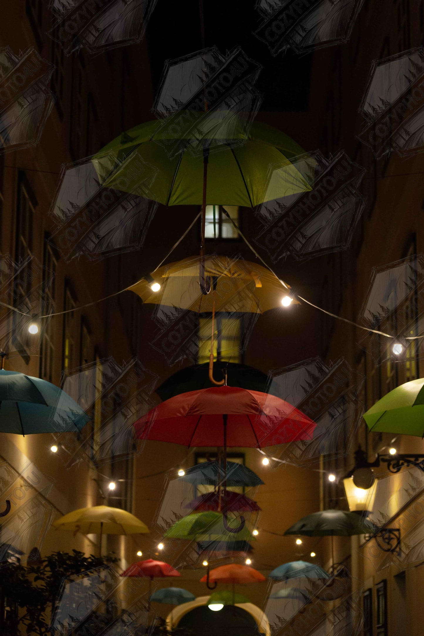 Digital picture art Nighttime street scene with colorful illuminated umbrellas hanging as decoration above a vibrant outdoor area