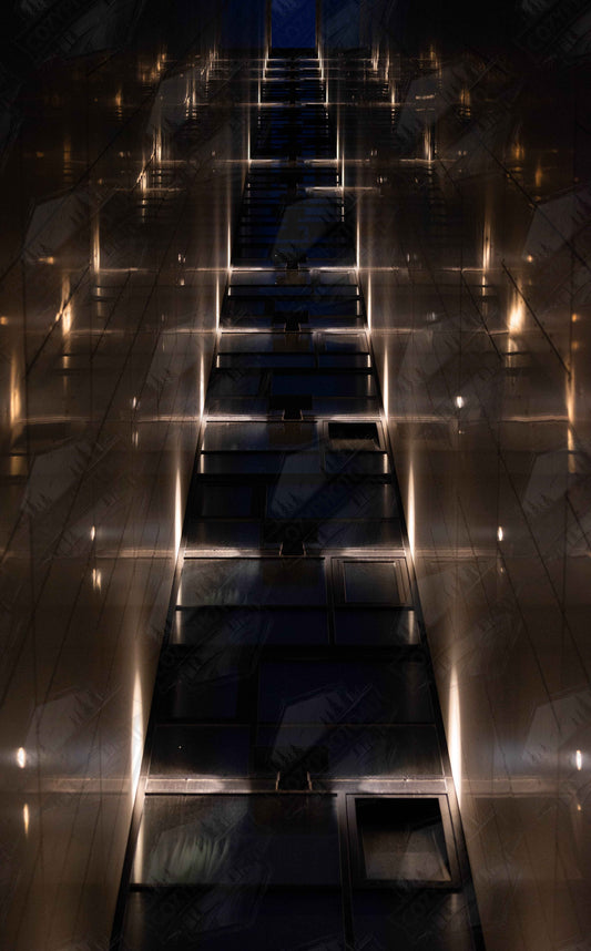 Digital Picture art Low angle view looking up a narrow corridor like passage between two skyscraper walls lined with rows of windows stretching toward the sky