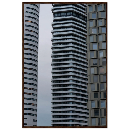 Modern high rise tower buildings with glass and steel facade reaching into the sky on wodden framed wall art