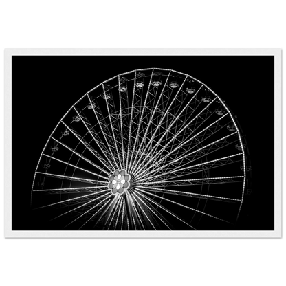 Black and white night photo of the Vienna Prater Giant Ferris Wheel (Wiener Riesenrad) with illuminated spokes forming a circular pattern against the dark sky on wooden framed wall art