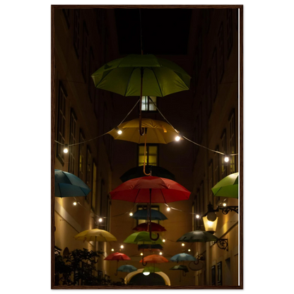 Nighttime street scene with colorful illuminated umbrellas hanging as decoration above a vibrant outdoor area on a wooden frame wall art