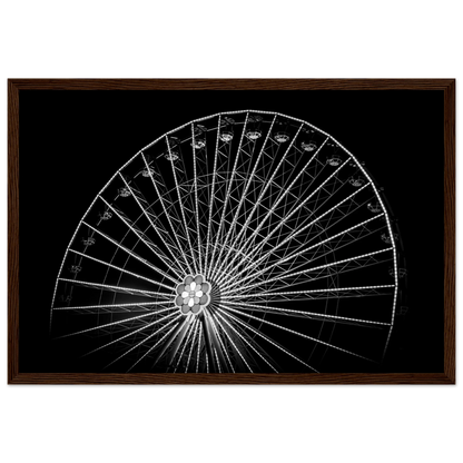 Black and white night photo of the Vienna Prater Giant Ferris Wheel (Wiener Riesenrad) with illuminated spokes forming a circular pattern against the dark sky on wooden framed wall art