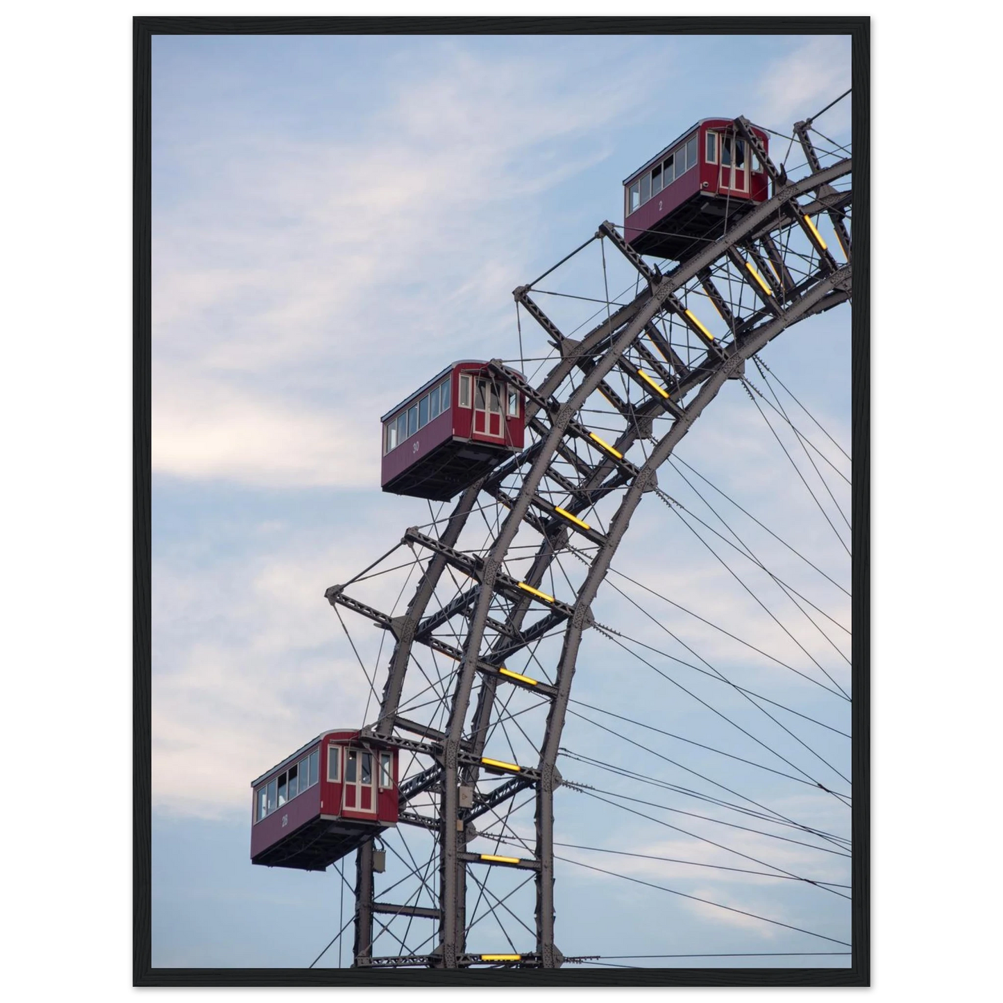 Close up of the historic Vienna Prater Giant Ferris Wheel (Wiener Riesenrad) showing its iconic steel structure and vintage mechanical details on wooden framed wall art