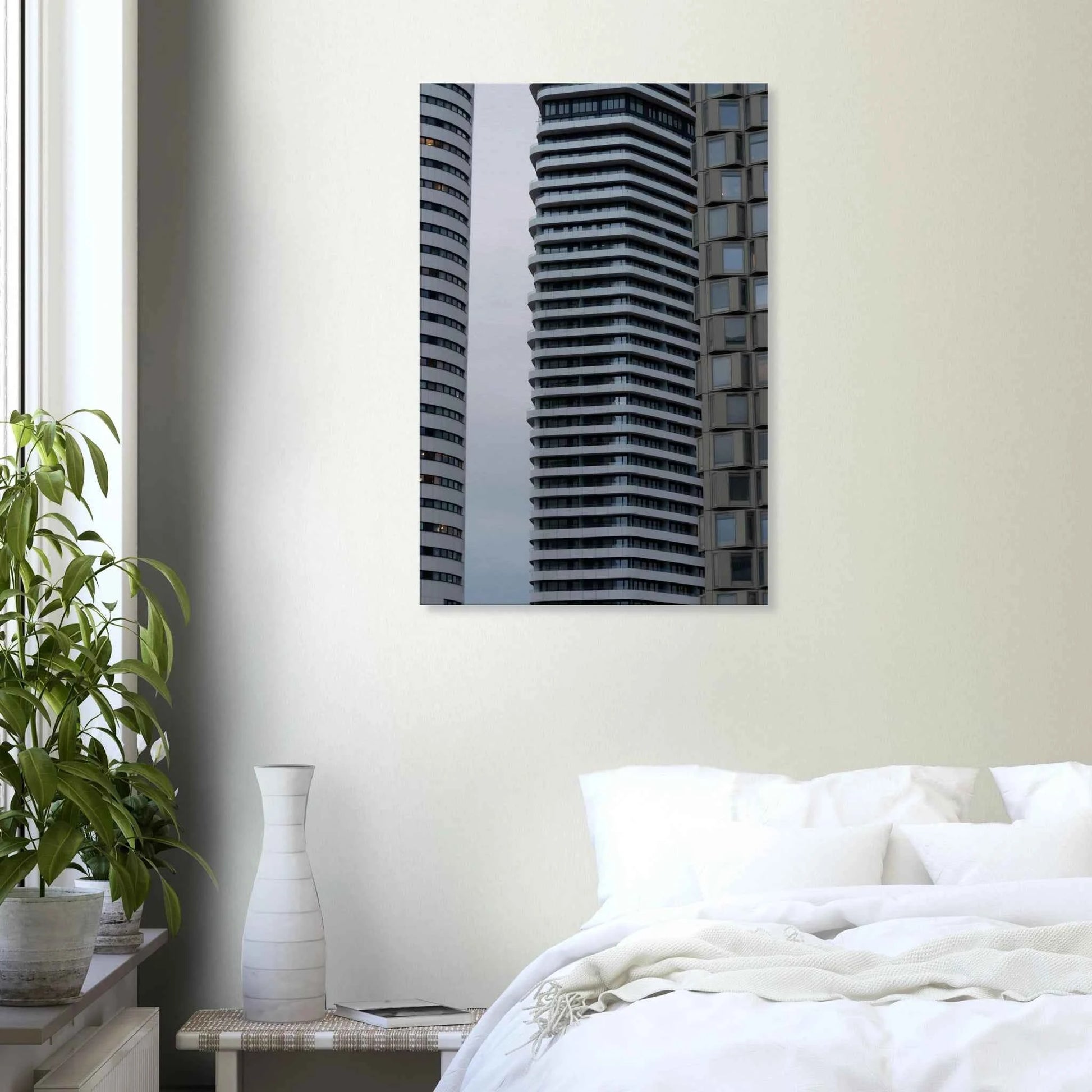 Modern high rise tower buildings with glass and steel facade reaching into the sky on Canvas Print wall art on the wall in the Bedroom