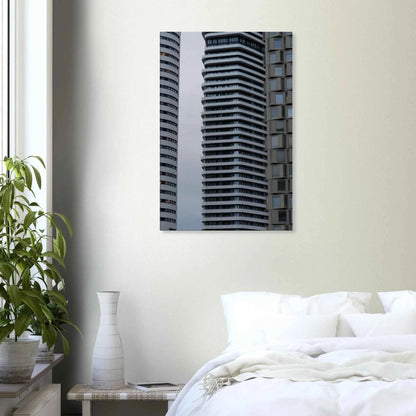 Modern high rise tower buildings with glass and steel facade reaching into the sky on Canvas Print wall art on the wall in the Bedroom